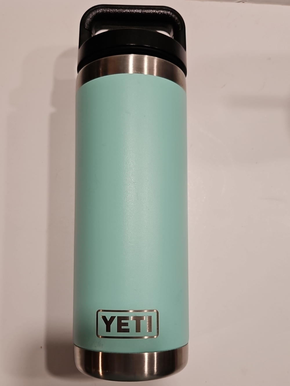 YETI RAMBLER, 18 OZ WATER BOTTLE. SEAFOAM, GREEN STAINLESS STEEL.